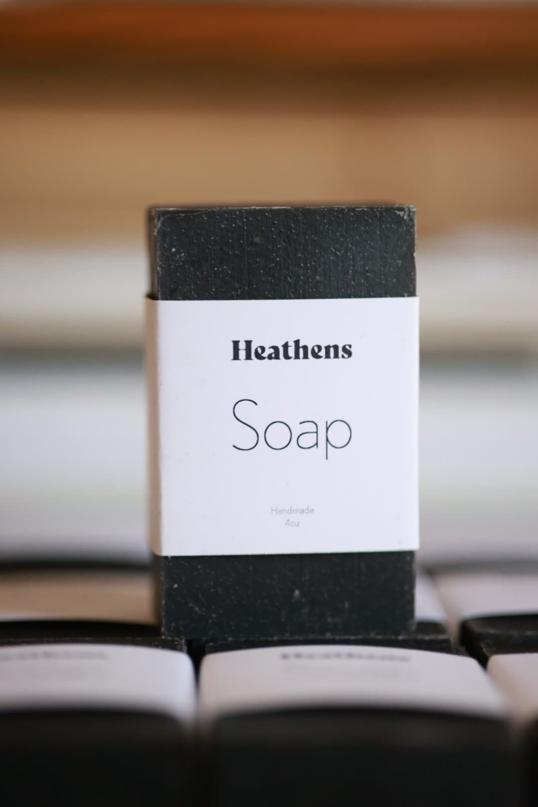 A bar of Heathens soap in its white band.